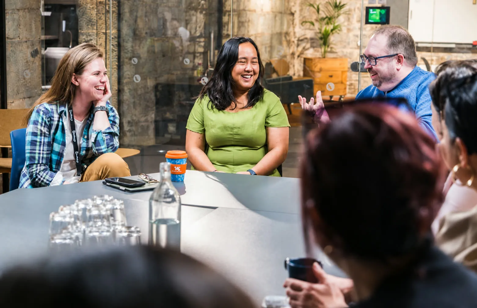 Founders around a table at a BUILTINCORK community meetup.