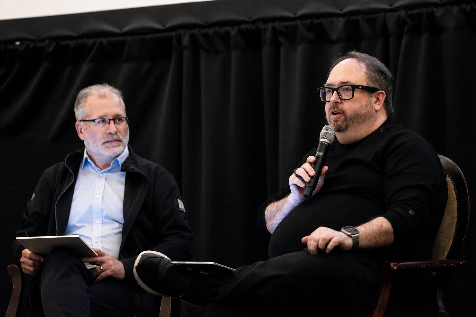 DC in conversation on a panel.